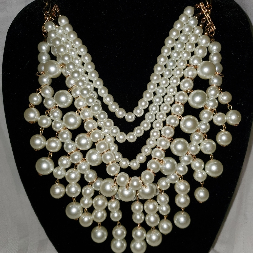 Statement pearl necklace with matching earrings.
